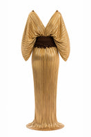 Gold Candela dress by Maylé Vásquez, elegant gown with intricate details and flowing fabric, perfect for formal occasions.