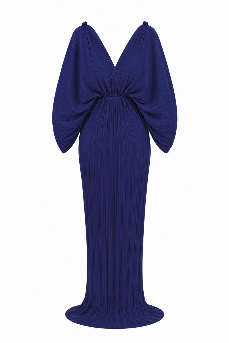 Navy blue Candela gown by Maylé Vásquez, elegant evening dress with flowing fabric and sophisticated design.
