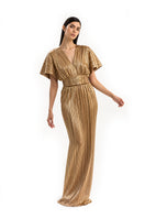Elegant gold Candela gown by Maylé Vásquez featuring flowing fabric and intricate detailing, perfect for formal occasions.