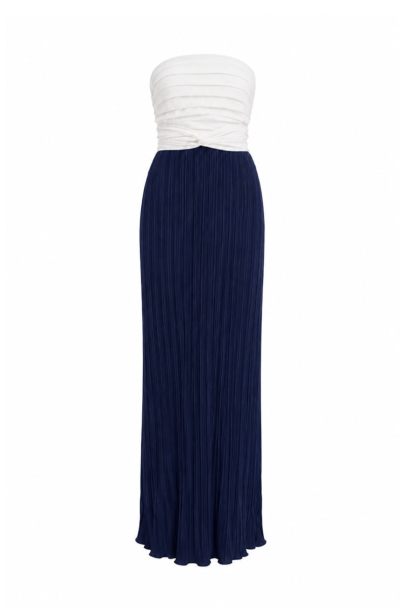 Navy blue and beige two-tone maxi dress by Maylé Vásquez, featuring flowing fabric and elegant design.