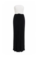 Black and white Canela two-tone maxi dress by Maylé Vásquez, flowing fabric with a stylish, elegant design.