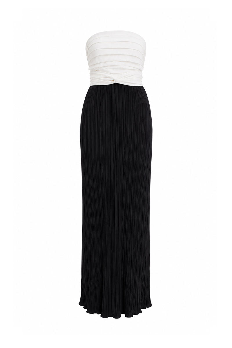 Black and white Canela two-tone maxi dress by Maylé Vásquez, flowing fabric with a stylish, elegant design.