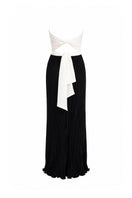 Maylé Vásquez Canela Two Tone Maxi Dress in black and white, flowing fabric, elegant design, perfect for formal or casual wear.