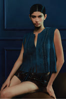 Blue CANIAYLA II suede vest by Double A, displayed on a hanger showcasing its soft suede texture and stylish design.