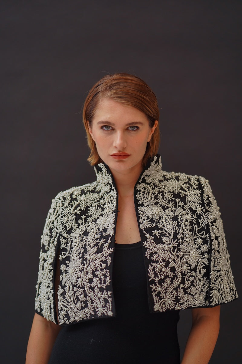 Nadya Shah Cape Anais jacket in elegant fabric, featuring a flowing design and detailed stitching, perfect for stylish wear.