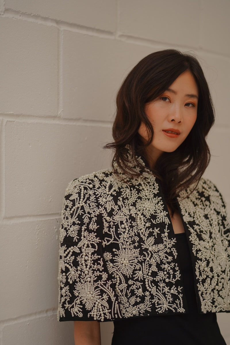 Nadya Shah Cape Anais jacket in soft fabric, featuring a stylish cape design and elegant drape, perfect for sophisticated outfits.