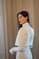 Nadya Shah Cape Eclat Ivory jacket displayed on a model, featuring a soft, elegant ivory fabric with a flowing design.