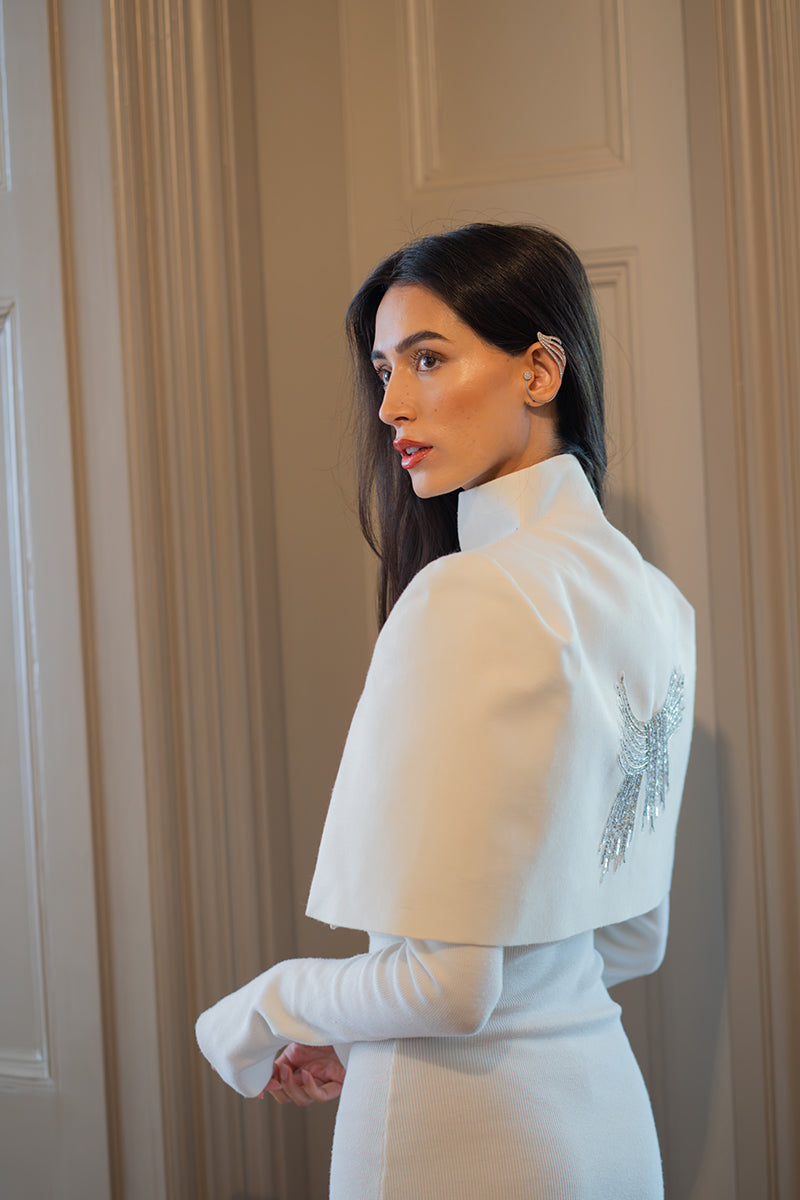 Nadya Shah Cape Eclat Ivory jacket displayed on a model, featuring a soft, elegant ivory fabric with a flowing design.