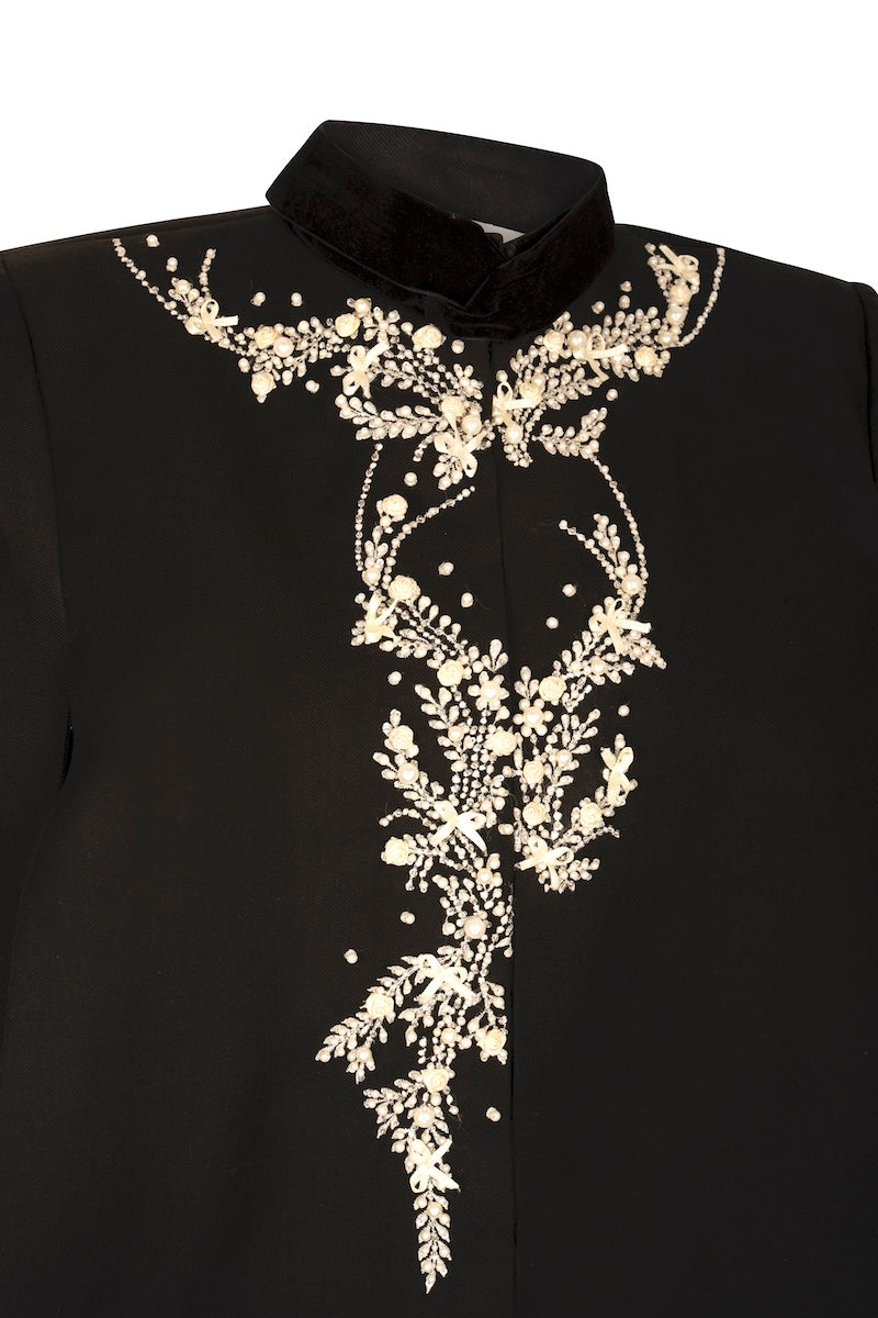 Nadya Shah Cape Nocturne jacket with intricate details and stylish design, shown on a model in a fashion photoshoot.
