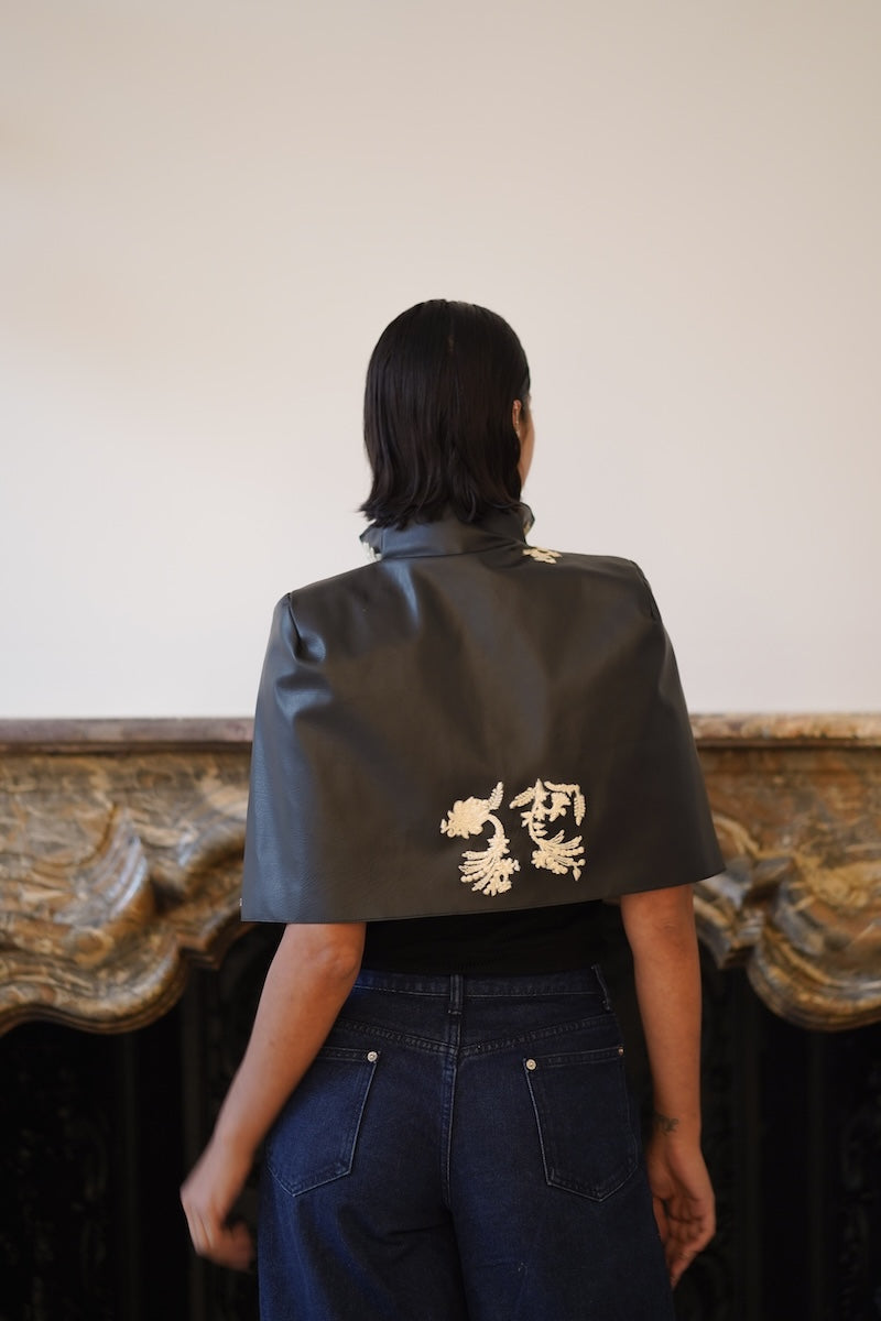 Nadya Shah Cape Victoire jacket shown from the back, featuring a stylish design and tailored fit in a sleek fabric.