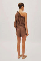 Labeca Capri Cappuccino linen shorts with a relaxed fit, perfect for casual summer wear.