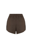 Labeca Capri Cappuccino linen shorts with a relaxed fit and elastic waistband, showcased on a model against a neutral background.
