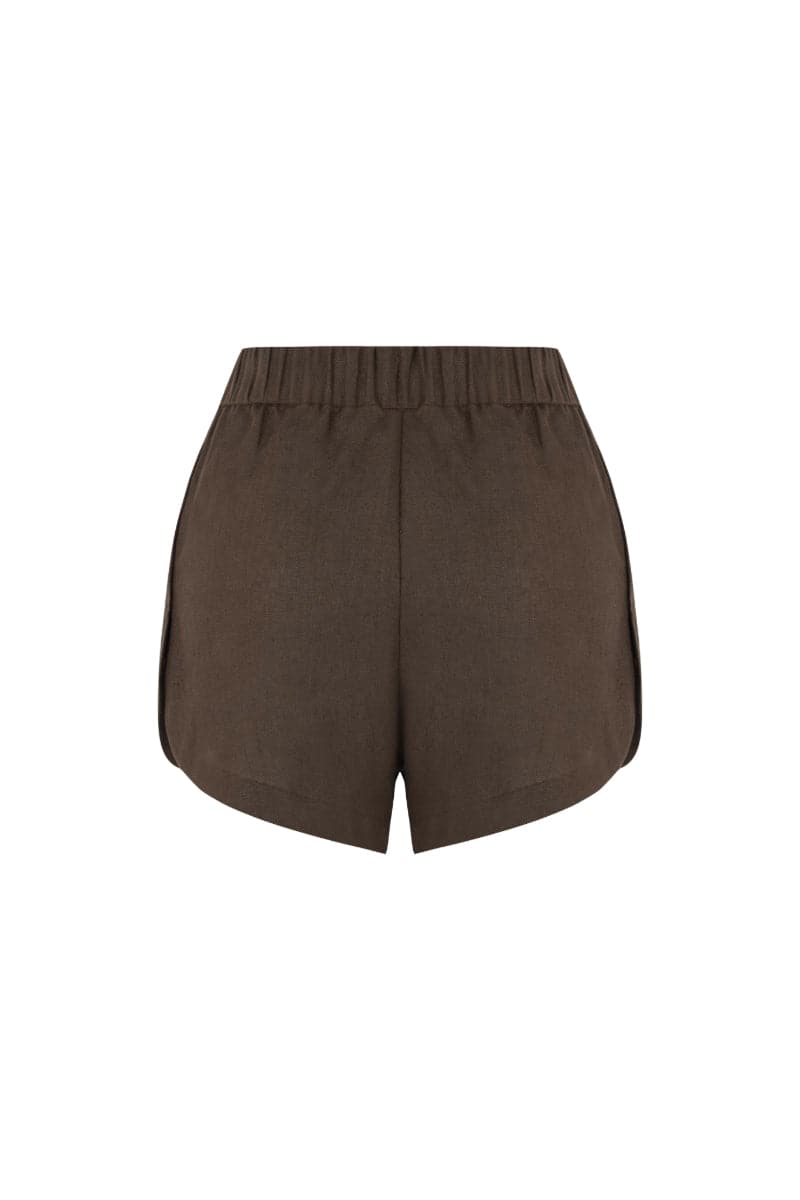 Labeca Capri Cappuccino linen shorts with a relaxed fit and elastic waistband, showcased on a model against a neutral background.