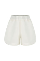 White linen Capri shorts by Labeca, featuring a relaxed fit and tailored design, perfect for warm weather casual wear.
