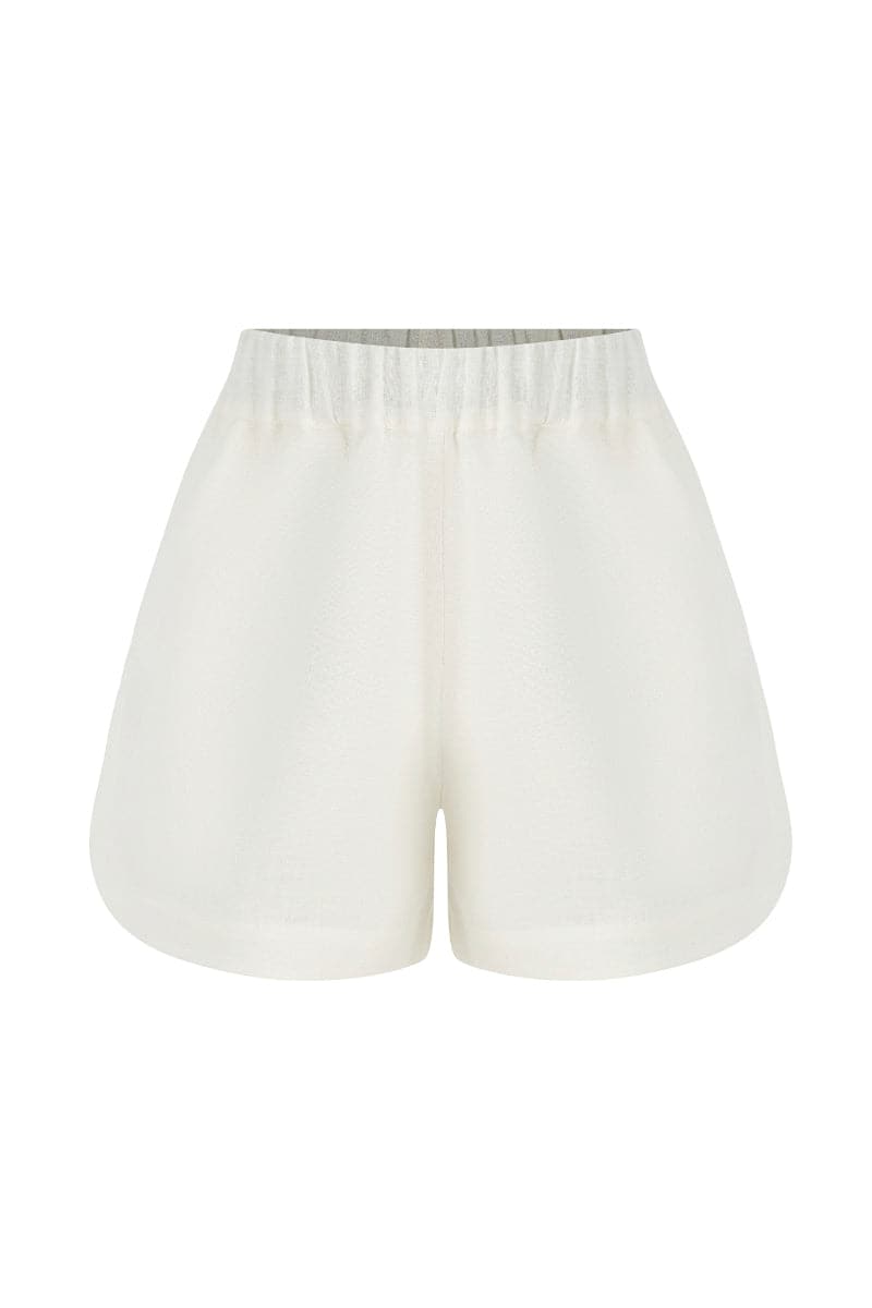 White linen Capri shorts by Labeca, featuring a relaxed fit and tailored design, perfect for warm weather casual wear.