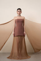 Elegant brown strapless gown with a cape from HACCHIC COUTURE, showcased on a model with flowing fabric and sophisticated design.