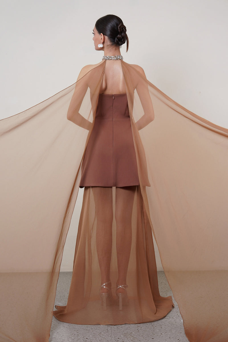 Brown strapless gown with matching cape by HACCHIC COUTURE, elegant floor-length dress displayed on a mannequin.