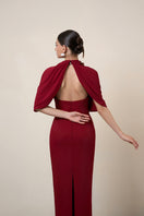 Red MOAZ maxi dress by HACCHIC COUTURE featuring flowing fabric and elegant design, shown on a model.