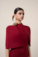 Red MOAZ maxi dress by HACCHIC COUTURE featuring flowing fabric and elegant design, styled for a sophisticated look.