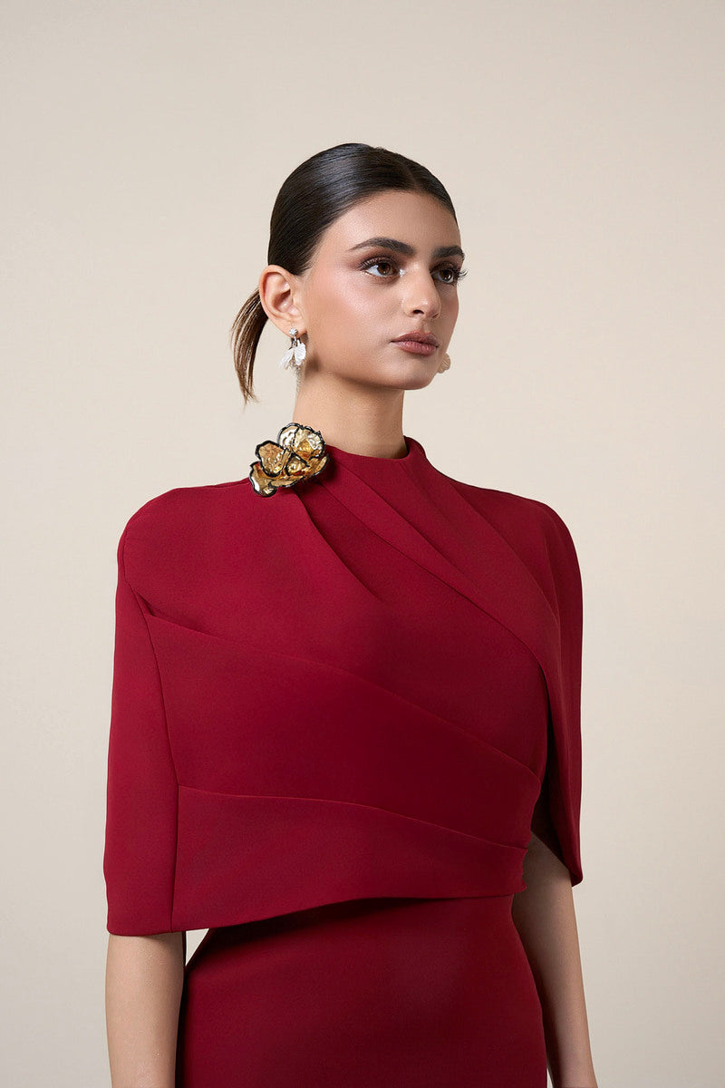 Red MOAZ maxi dress by HACCHIC COUTURE featuring flowing fabric and elegant design, styled for a sophisticated look.