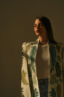 Nadya Shah Cara Leaf Cape jacket featuring a vibrant leaf pattern, lightweight fabric, and a flowing, stylish design.