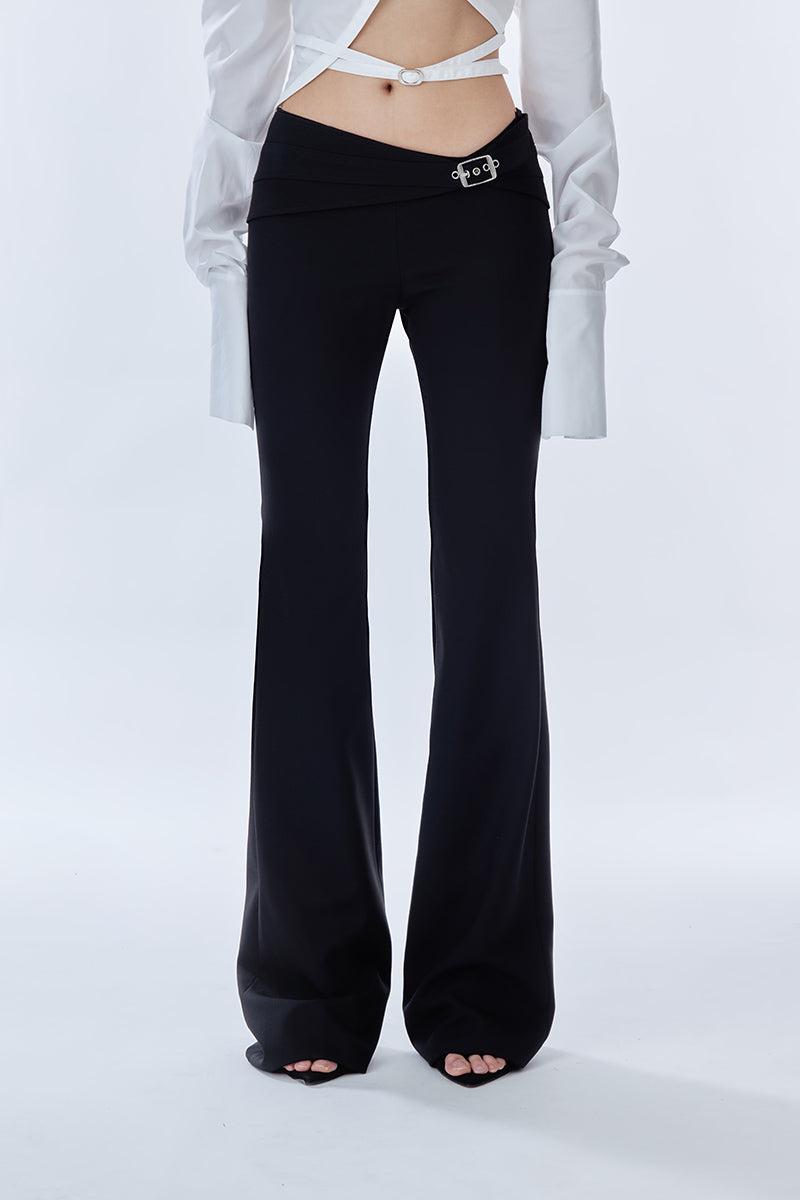 Black Carats belt pants from Stolen Stores featuring a stylish belt and tailored fit, shown on a model in the image.
