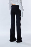 Black Carats Belt Pants by Stolen Stores, featuring a stylish belt and tailored fit, shown on a model.