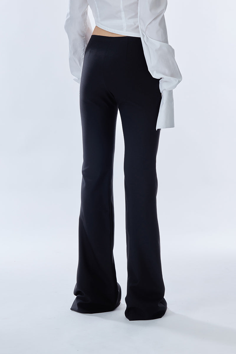 Black Carats Belt Pants by Stolen Stores, featuring a stylish belt and tailored fit, shown on a model.