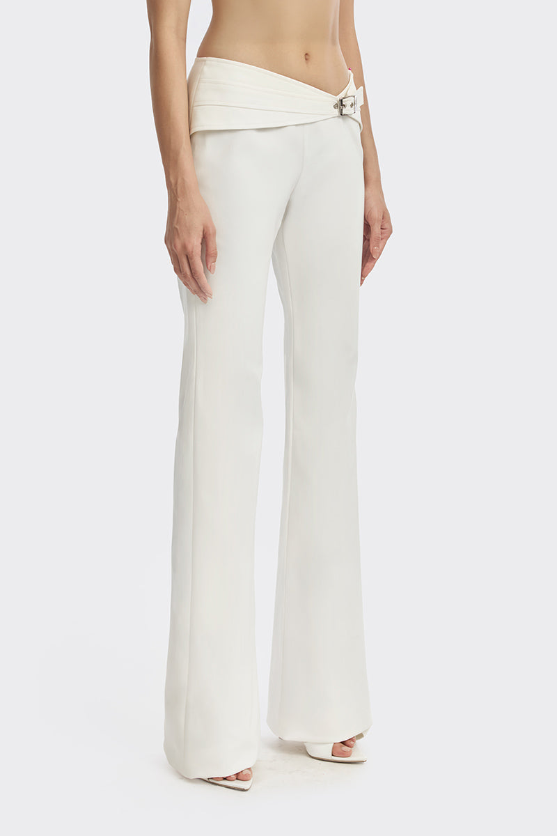 Off-white Carats Belt Pants by Stolen Stores featuring a stylish belt and tailored fit, shown in a natural stance.