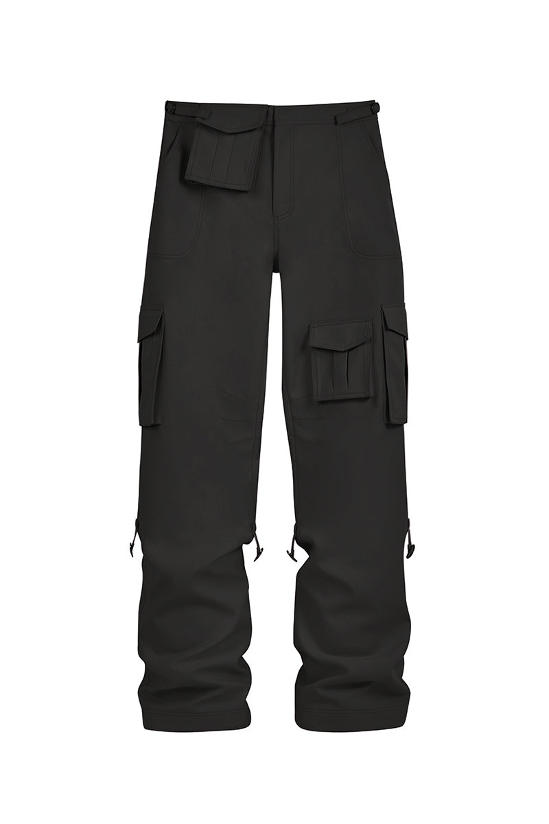 Black Stolen Stores cargo pants with multiple pockets and relaxed fit, shown on a model in a casual setting.