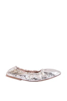 A pair of AERA Carla Gold Foil-Effect Flats with shiny gold finish and sleek slip-on design on a white background.