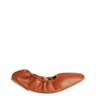 A pair of AERA Carla Tan Nappa flats with pointed toes and smooth tan leather finish, displayed on a neutral background.
