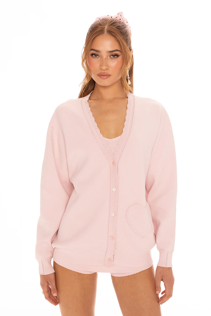 Pink Nana Jacqueline Carrie cardigan with long sleeves and ribbed cuffs, styled in a cozy, casual look.