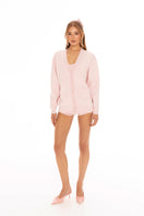 Pink Nana Jacqueline Carrie cardigan displayed on a model, featuring a soft knit fabric and button-front design.