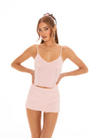 Nana Jacqueline Carrie pink shorts displayed on a model, showcasing stylish casual shorts with a relaxed fit and vibrant color.