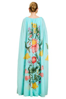 Back view of Mestiza New York Cartagena convertible cape gown in San Juan Garden with flowing maxi dress design.