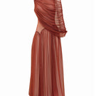 Rust-colored cascade maxi dress by Yassmin Saleh, featuring a flowing silhouette and elegant front design.
