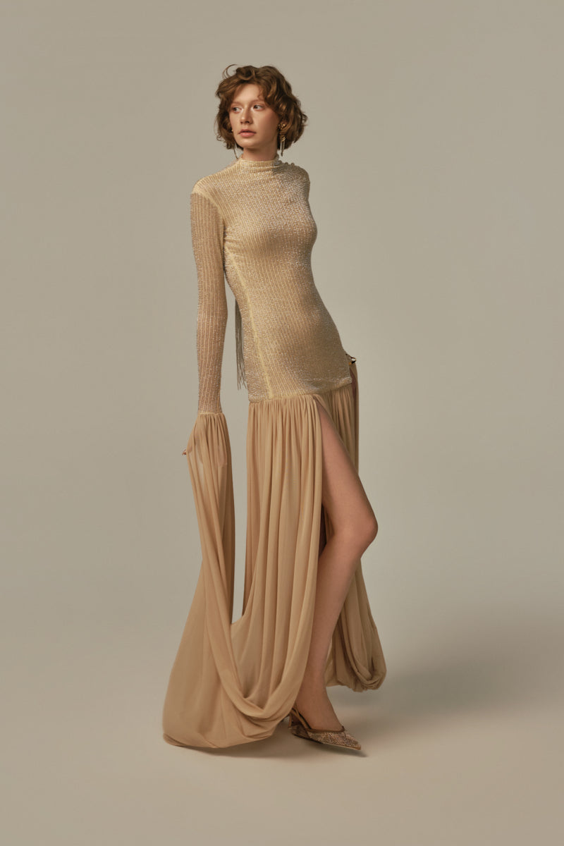 Poem Cascade gown in warm sand color, flowing fabric with elegant, layered design, displayed on model.