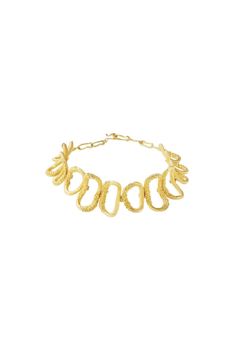 Gold Cassandra choker necklace by Jude Benhalim featuring a sleek, minimalist design on a neutral background.