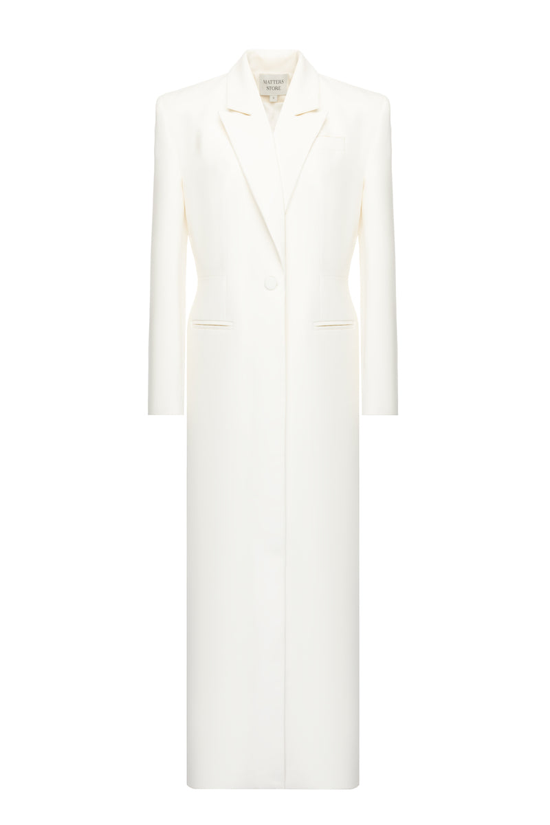 Matters Ivory Celine coat displayed on a hanger, showcasing elegant, lightweight coat with clean lines and classic style.