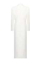 Matters Celine ivory coat displayed on a hanger, showcasing sleek design and elegant fabric in a well-lit setting.