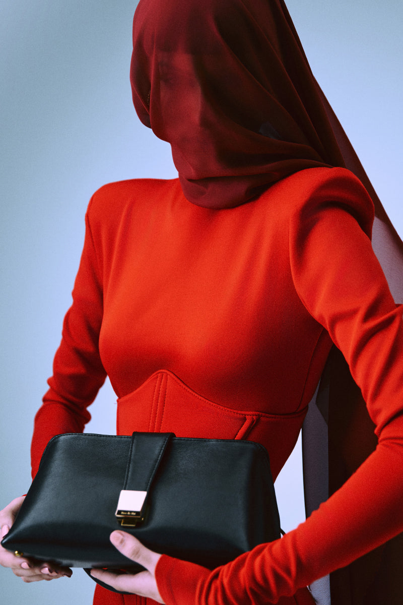 Black Rose de Mai Ceremony clutch bag with sleek design, featuring a compact, elegant style for formal occasions.