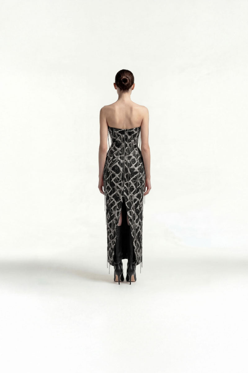 Elegant strapless midi dress by Tayfun Kaba with chain embellishments, featuring a fitted silhouette and stylish design.
