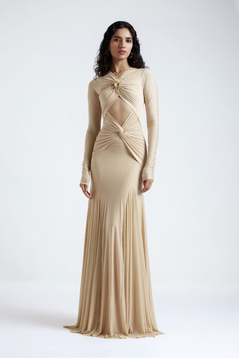 Beige Chantal gown by Deme By Gabriella featuring elegant fabric and flowing design, shown hanging against a neutral background.