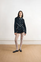 Black charcoal shirt by Yassmin Saleh, front view showing classic collar and button-down design.