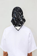 Elegant silk Charkol scarf by Amel Batita featuring a signature design, perfect as a versatile accessory or headscarf.
