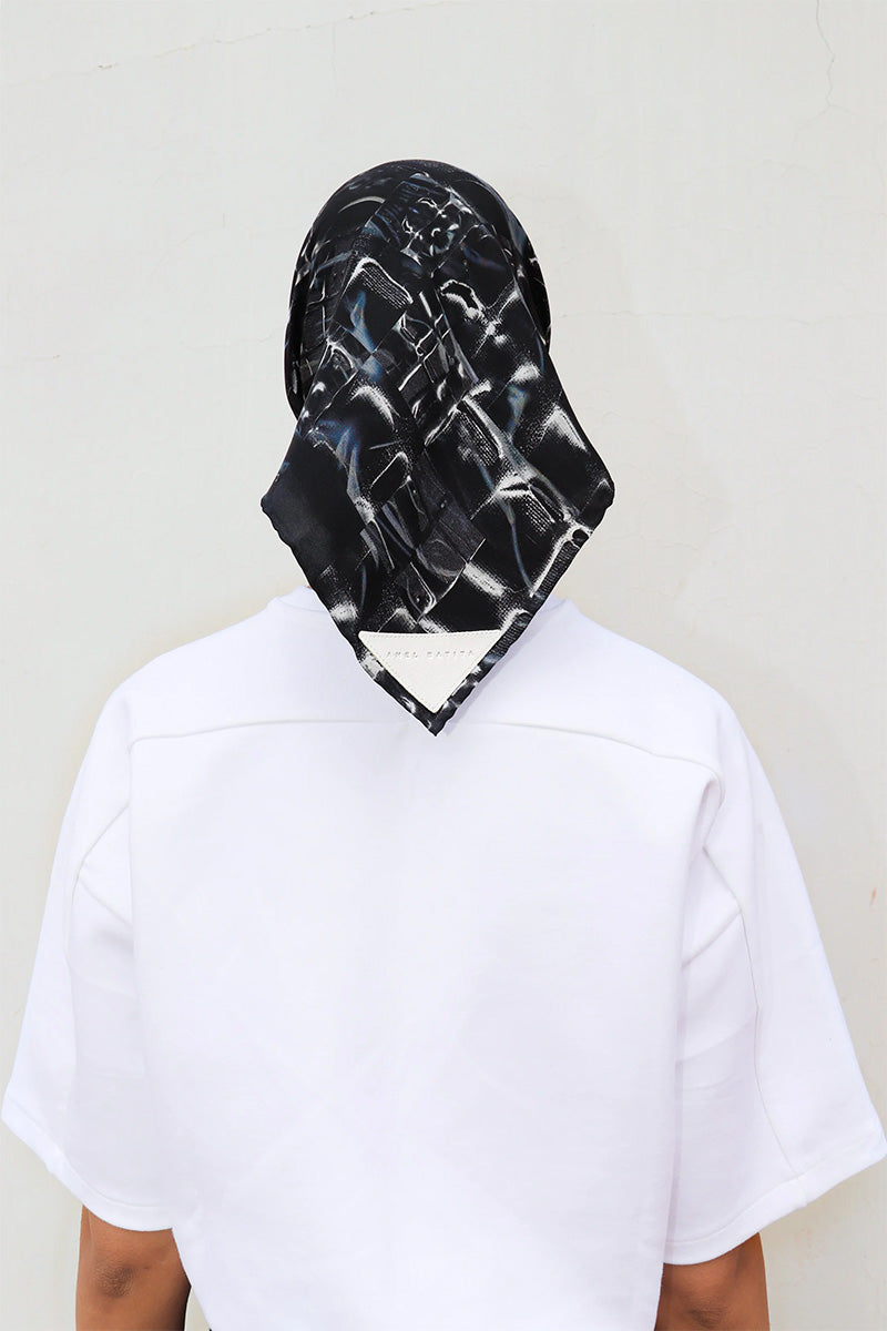 Elegant silk Charkol scarf by Amel Batita featuring a signature design, perfect as a versatile accessory or headscarf.