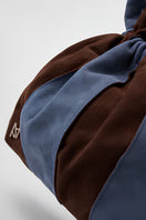 Blue Double A Charlie II suede shoulder bag featuring a sleek design with top handle and adjustable strap.