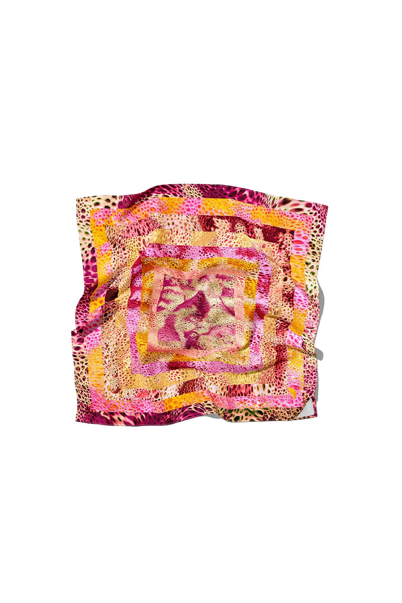 Amel Batita cheetah print silk scarf displayed flat, showcasing its vibrant animal print design and soft, luxurious fabric.