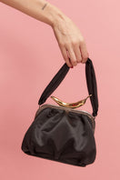 Sarah's Bag black leather shoulder bag with chili design, featuring a sleek Bella style with a shoulder strap and compact shape.